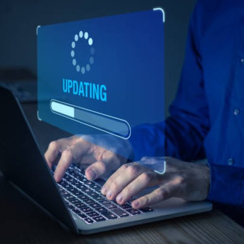 Software update or operating system upgrade to keep the device up to date with added functionality in new version and improve security. Updating progress bar on computer screen. Installing app patch.